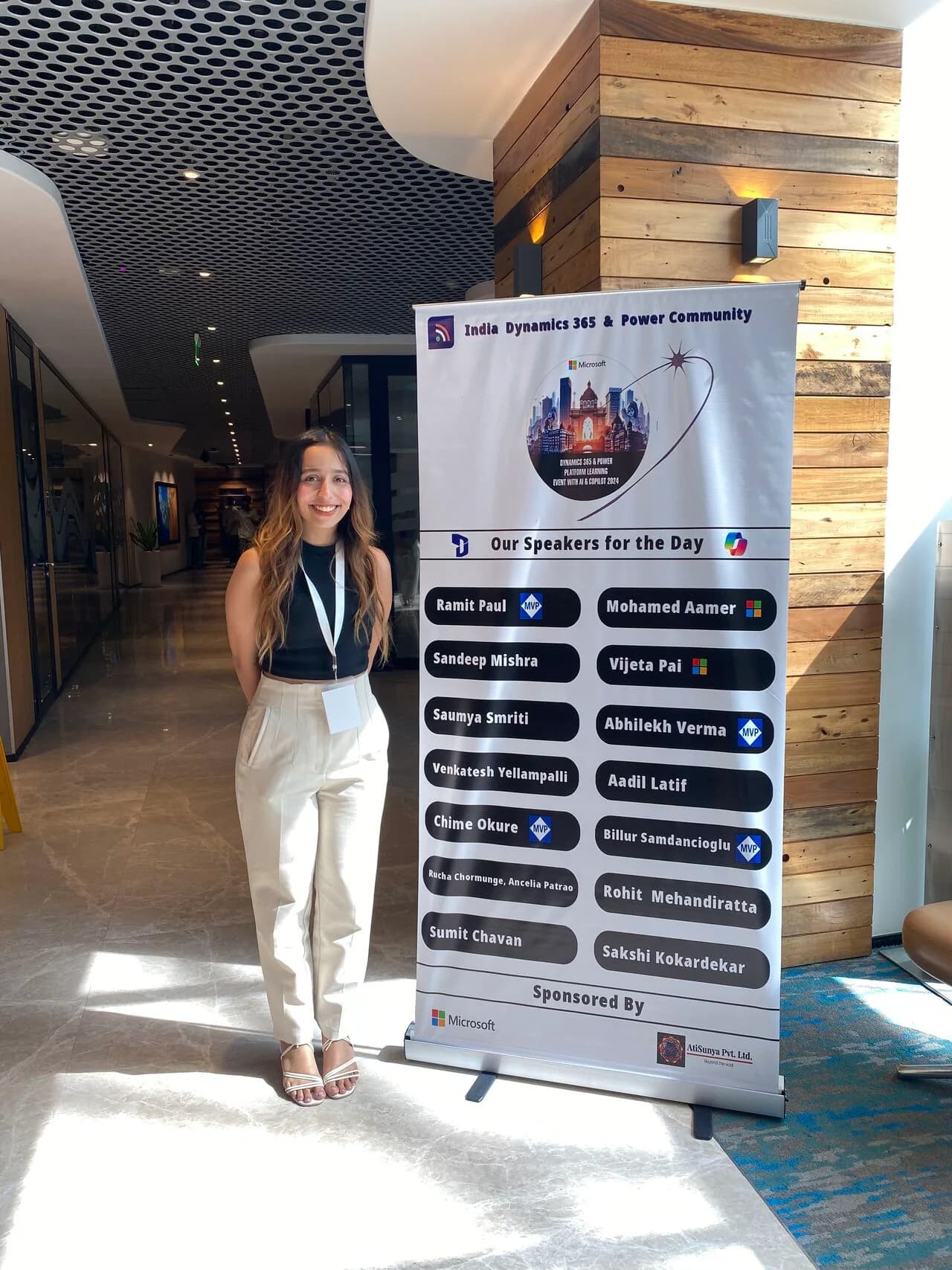Saumya Smriti beside the India Dynamics 365 & Power Community speaker banner.